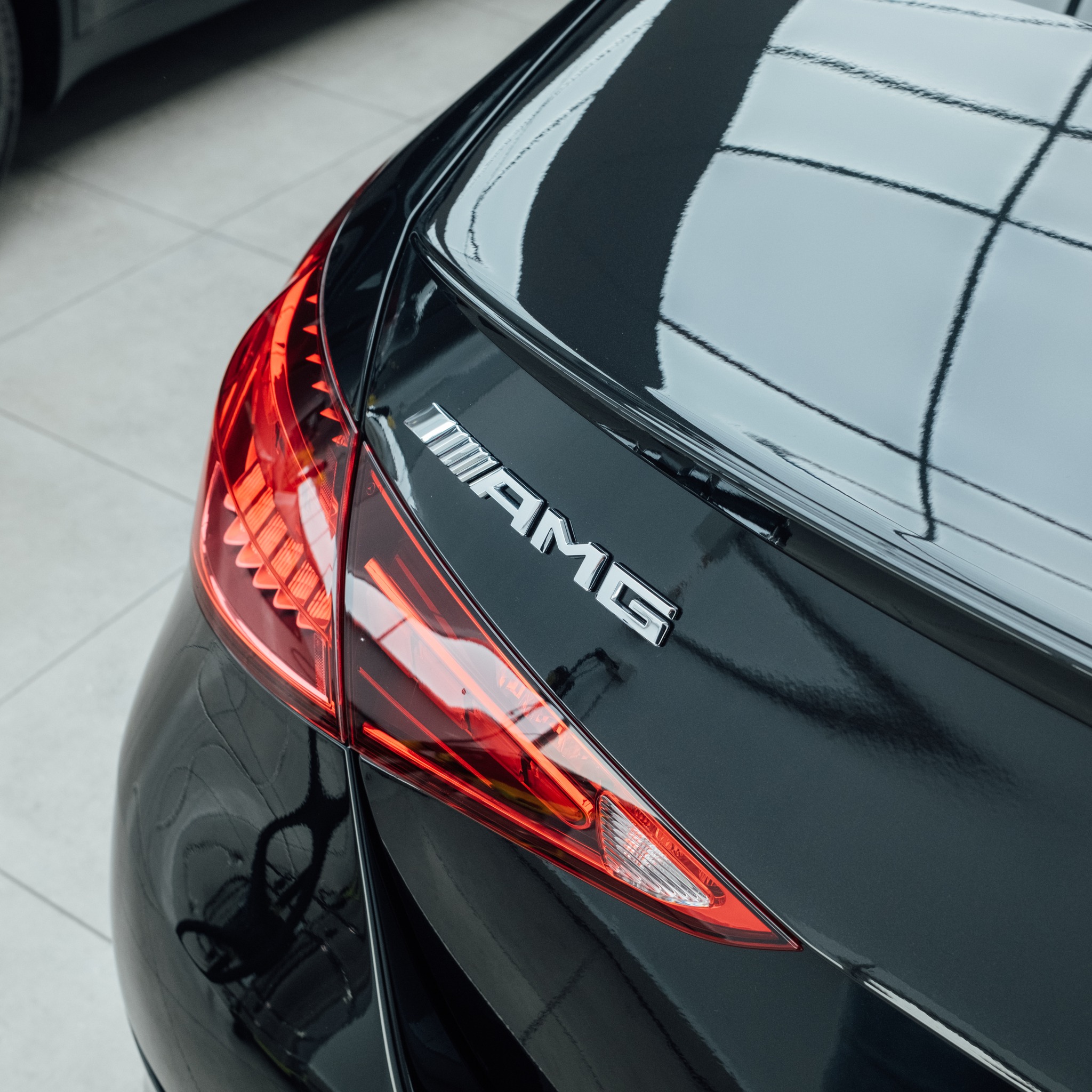 Paint protection film absorbing impact across a vehicle front end
