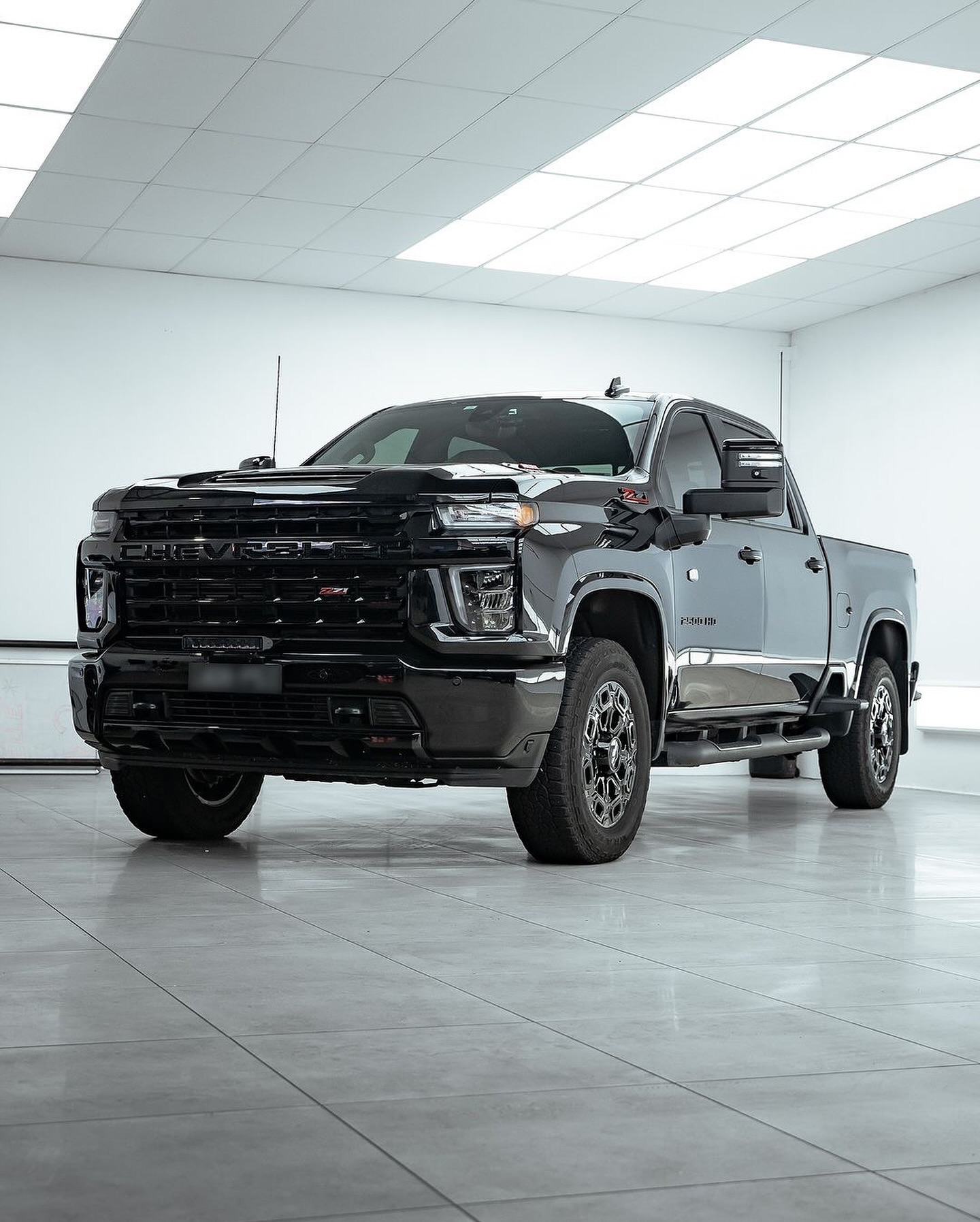 Ceramic coating and paint protection film compared on a vehicle